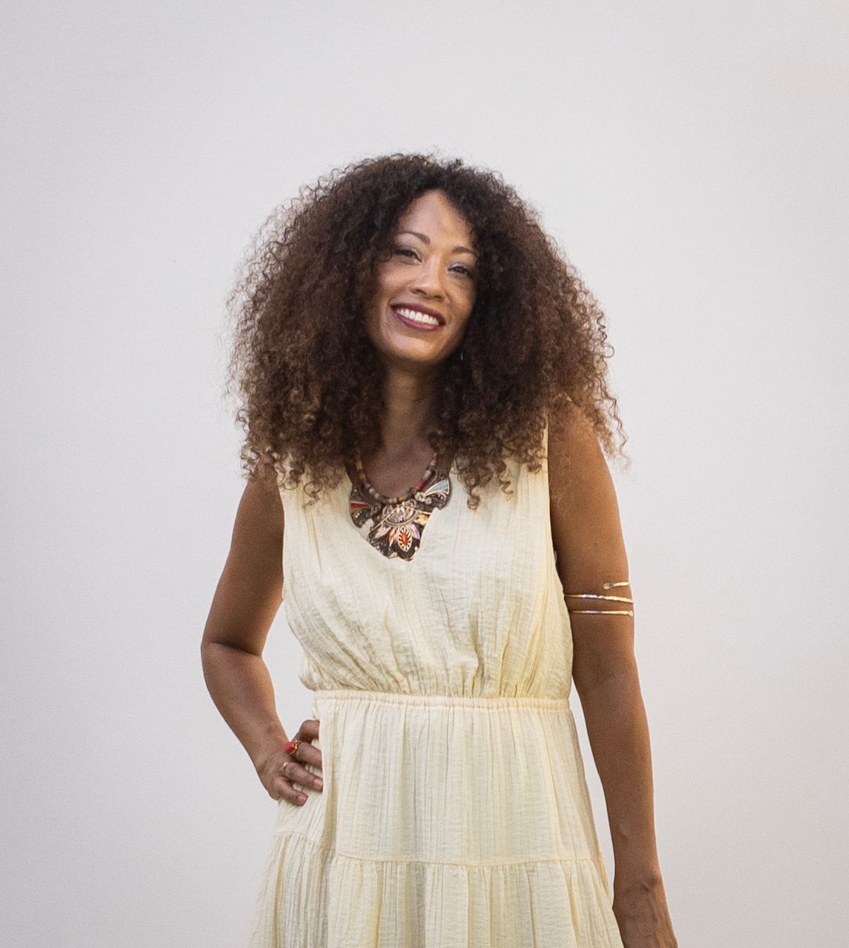 MiShawn Williams smiling in a pale yellow dress